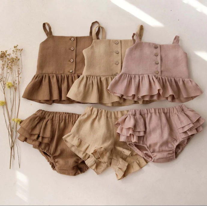 Set of ruffled tops and bloomers in brown and pink on a white backgroundshop_this_look_EcLGgQ